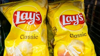 Lay's potato chips packets seen in a supermarket