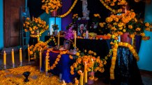 XALPATLAHUAC, MEXICO - NOVEMBER 02: An altar of the dead (Altar de Muertos), a religious site honoring the deceased, is placed inside a house during the Day of the Dead celebrations on November 2, 2021 in Xalpatláhuac, Mexico. Day of the Dead (Día de Muertos), a religious holiday combining the death veneration rituals of Pre-Hispanic cultures with the Catholic practice, is widely celebrated throughout all of Mexico. Based on the belief that the souls of the departed may come back to this world on that day, people gather to pray, eat, drink or play music, to remember friends or family members who have died and to support their souls on the spiritual journey. (Photo by Jan Sochor/Getty Images)