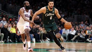 James Harden #1 of the Philadelphia 76ers defends Jayson Tatum #0 of the Boston Celtics during the second half at TD Garden on October 18, 2022 in Boston, Massachusetts.