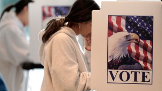 People cast early ballots during the midterm election at the University of Michigan Museum of Art on November 7, 2022. (Photo by JEFF KOWALSKY / AFP) (Photo by JEFF KOWALSKY/AFP via Getty Images)