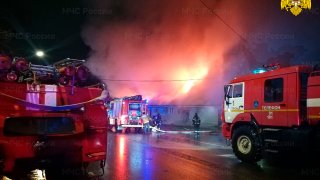 In this handout photo released by the Russian Emergency Ministry Press Service, firefighters try to extinguish a fire at a cafe in Kostroma, Russia, Saturday, Nov. 5, 2022. Russia emergency officials said the fire killed multiple people in Kostroma, north of Moscow. (Russian Emergency Ministry Press Service via AP)