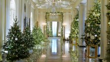Cross Hall of the White House is decorated for the holiday season during a press preview of holiday decorations at the White House,