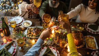Family toasting on Christmas dinner at home