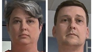 FILE - These booking photos released Oct. 9, 2021, by the West Virginia Regional Jail and Correctional Facility Authority show Diana Toebbe, left, and Jonathan Toebbe.