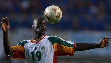 Pape Bouba Diop heads the ball during the Senegal-France opening game for the 2002 FIFA World Cup Korea/Japan in Seoul, May 31, 2002. Diop scored the first, and only, goal of the game, leading his team to a victorious upset against France.