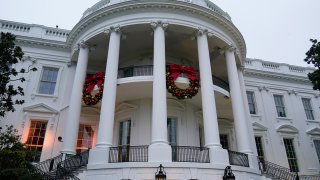 FILE - Wreaths hang on the Truman Balcony of the White House