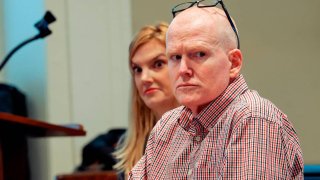 FILE - Alex Murdaugh, right, sits in court with his legal team, including attorney Margaret Fox,