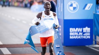 Eliud Kipchoge of Kenya celebrates his marathon world record of 2:01:09 after crossing the finish line at the 2022 BMW Berlin-Marathon on Sept. 25, 2022.