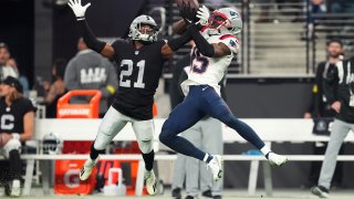 LAS VEGAS, NEVADA – DECEMBER 18: Amik Robertson #21 of the Las Vegas Raiders breaks up a pass intended for Nelson Agholor #15 of the New England Patriots during the second half at Allegiant Stadium on December 18, 2022 in Las Vegas, Nevada. (Photo by Chris Unger/Getty Images)