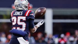 Marcus Jones of the New England Patriots returns an interception for a touchdown during the third quarter against the Cincinnati Bengals at Gillette Stadium in Foxborough, Massachusetts, on Saturday, Dec. 24, 2022.