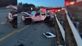 A Jeep Wrangler that crashed after rolling over on Interstate 93 in Manchester, New Hampshire, on Wednesday, Dec. 21, 2022, seriously injuring the driver.