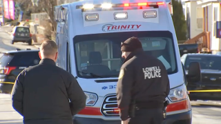 An ambulance at the scene of a pedestrian accident that left a man injured in Lowell, Massachusetts, on Wednesday, Dec. 14, 2022.