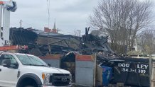 A South Second Street building completely collapsed in New Bedford, Massachusetts, following a massive overnight fire on Saturday, Dec. 3, 2022.