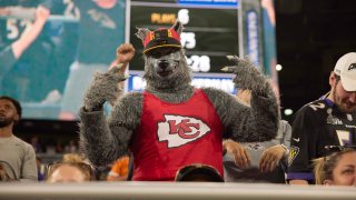 A Kansas City Chiefs fan in the stands wearing a wolf costume during a 2021 game vs. the Baltimore Ravens at M&T Bank Stadium in Baltimore, Md.