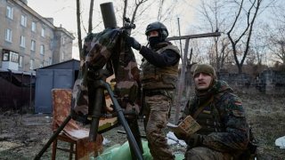 Ukrainian soldiers of a special forces unit prepare to fire mortar shells at Russian forces amid artillery fights on Dec. 20, 2022, in Bakhmut, Ukraine.