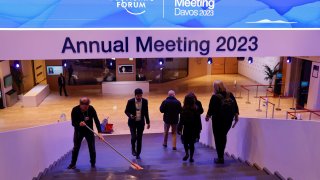 A worker mops a staircase inside the Congress Center ahead of the World Economic Forum (WEF) in Davos, Switzerland, on Monday, Jan. 16, 2023.