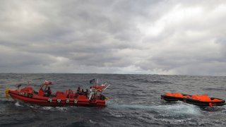 In this photo provided by the Korea Coast Guard, a South Korea coast guard vessel conducts a search operation