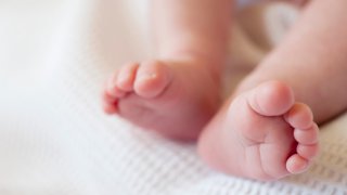 An image showing a pair of baby's feet.