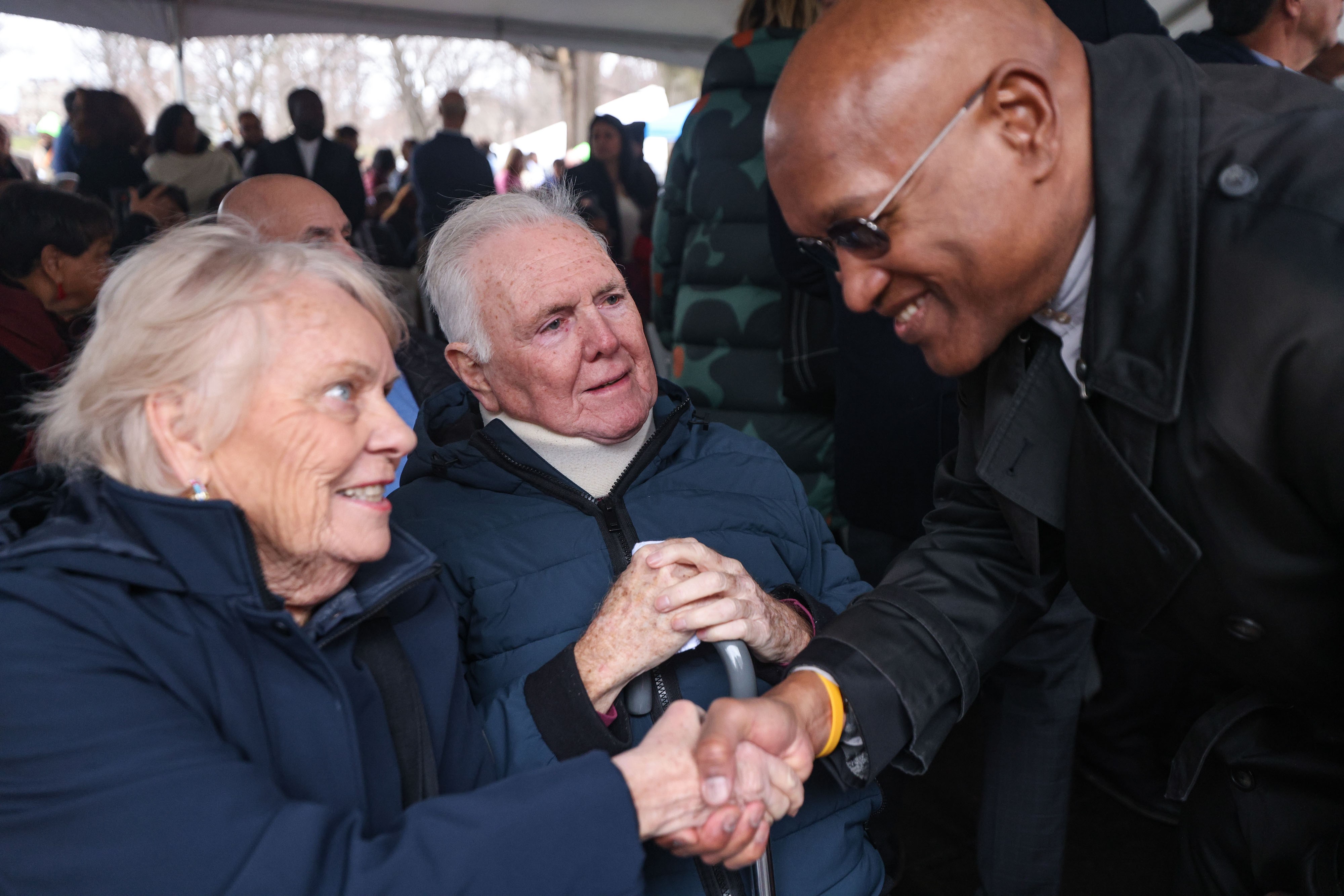 Former Boston Mayor Ray Flynn and his wife Kathy are greeted by the Rev. Ray Hammond.