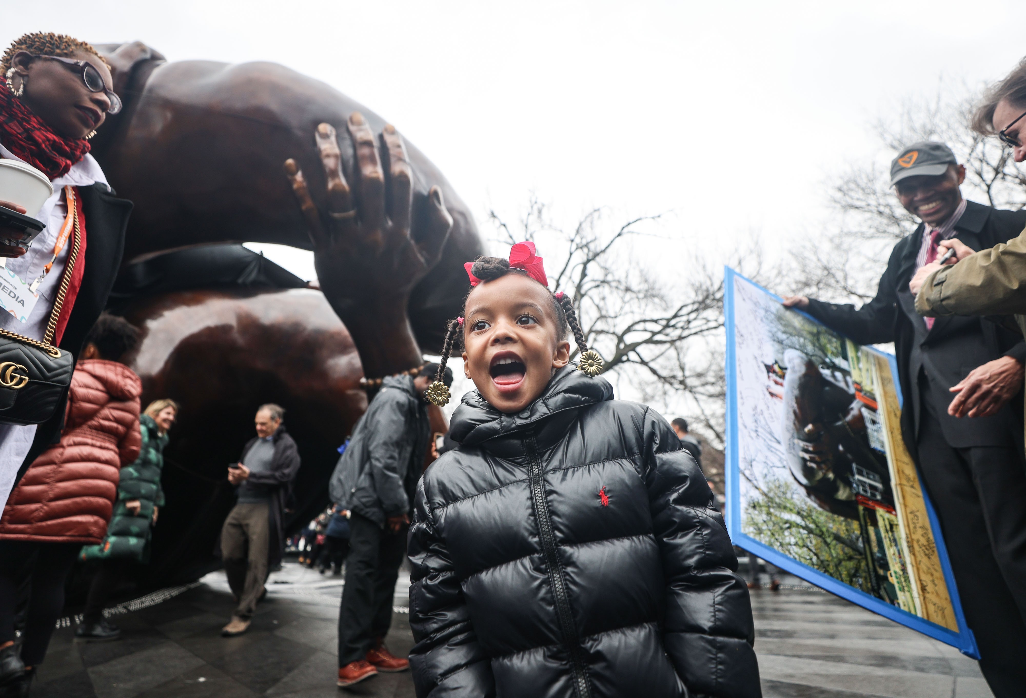 Zenzele Thomas, age 4, the daughter of "The Embrace" memorial's designer, Hank Willis Thomas, at Friday's ceremony.