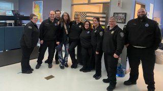 Singer Steven Tyler with members of the Plymouth County, Massachusetts, mutual aid fire dispatch team.