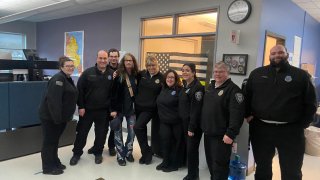 Singer Steven Tyler with members of the Plymouth County, Massachusetts, mutual aid fire dispatch team.