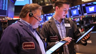 Traders work on the floor of the New York Stock Exchange during morning trading on January 04, 2023 in New York City.