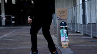 Skateboarders skate in front of city hall in remembrance of Tyre Nichols, who died after being beaten by Memphis police officers, five of whom have been fired, in Memphis, Tenn., Monday, Jan. 23, 2023.