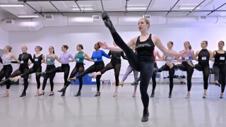 Amarisa LeBar, front, a Radio City Rockette, leads students in a Rockettes Precision Dance Technique course Wednesday, Feb. 8, 2023, at the Boston Conservatory at Berklee in Boston. LeBar, 25, of Iselin, N.J., started teaching at her mother's dance studio at 16, but finds sharing the Rockettes' style with college students definitely more intense. (AP Photo/Josh Reynolds)