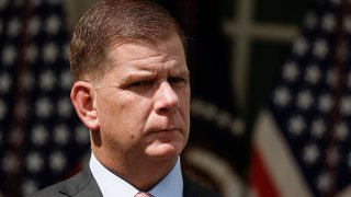 FILE - Labor Secretary Marty Walsh listens as U.S. President Joe Biden speaks during an event in the Rose Garden of the White House, Sept. 15, 2022, in Washington, D.C.