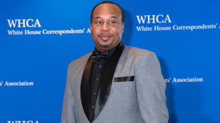 FILE - Comedian Roy Wood Jr. poses for photographers as he arrives to the annual White House Correspondents' Association Dinner, April 30, 2022.