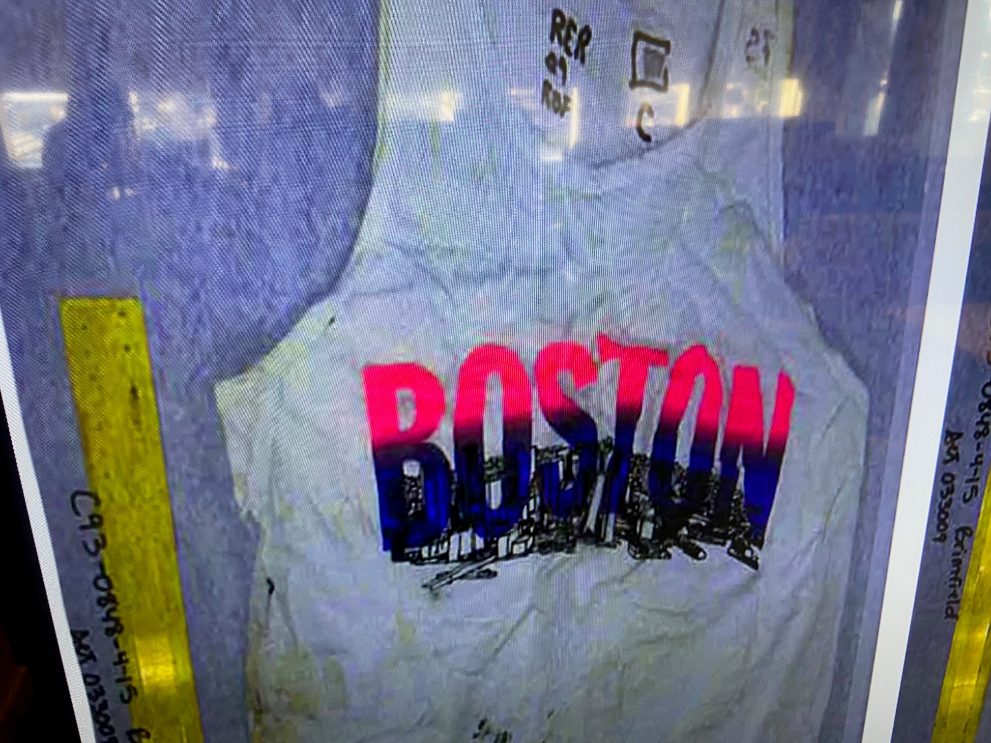 white tank top that says Boston on the front of it