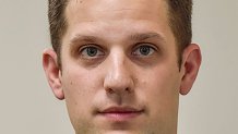 An updated ID photo of journalist Evan Gershkovich.