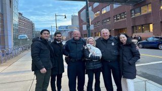 Millie the dog is reunited with her owner after she was rescued by a group of MIT students.