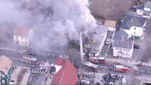 Smoke pouring from a building fire in Lynn, Massachusetts, on Friday, March 31, 2023.