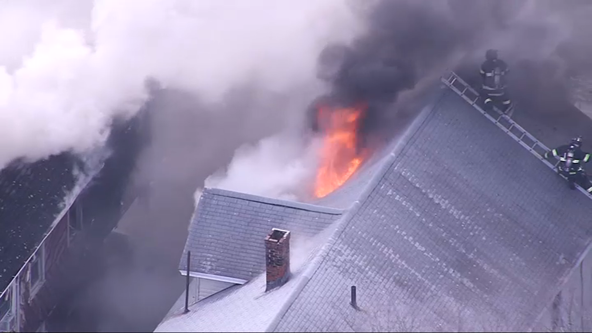 Smoke pouring from a building fire in Lynn, Massachusetts, on Friday, March 31, 2023.