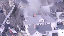 Smoke pouring from a building fire in Lynn, Massachusetts, on Friday, March 31, 2023.