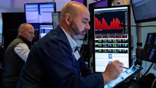 Traders work on the floor of the New York Stock Exchange on June 16, 2022.