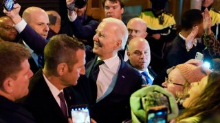 President Joe Biden takes a selfie with people in the crowd as he leaves after speaking at the Windsor Bar and Restaurant in Dundalk, Ireland, April 12, 2023.