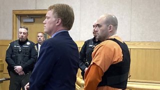 Joseph Eaton, the suspect in a shooting spree in Maine, appears in court in West Bath, Maine, April 20, 2023. Eaton, who police say confessed to killing four people in a home and then shot three others randomly on a busy highway, had been released days earlier from prison.