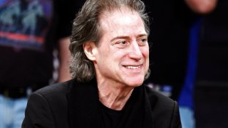 FILE – Comedian Richard Lewis attends an NBA basketball game in Los Angeles on Dec. 25, 2012.