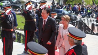 Mass. Governor Maura Healey and South Korea's President Yoon Suk Yeol approach the Massachusetts Statehouse, Friday, April 28, 2023, in Boston, Mass. Yoon stopped at the State House ahead of a talk at Harvard University as he wrapped up a state visit to the United States.