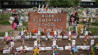 Crosses set up to honor those who lost their lives during the Robb Elementary School shooting in Uvalde, Texas