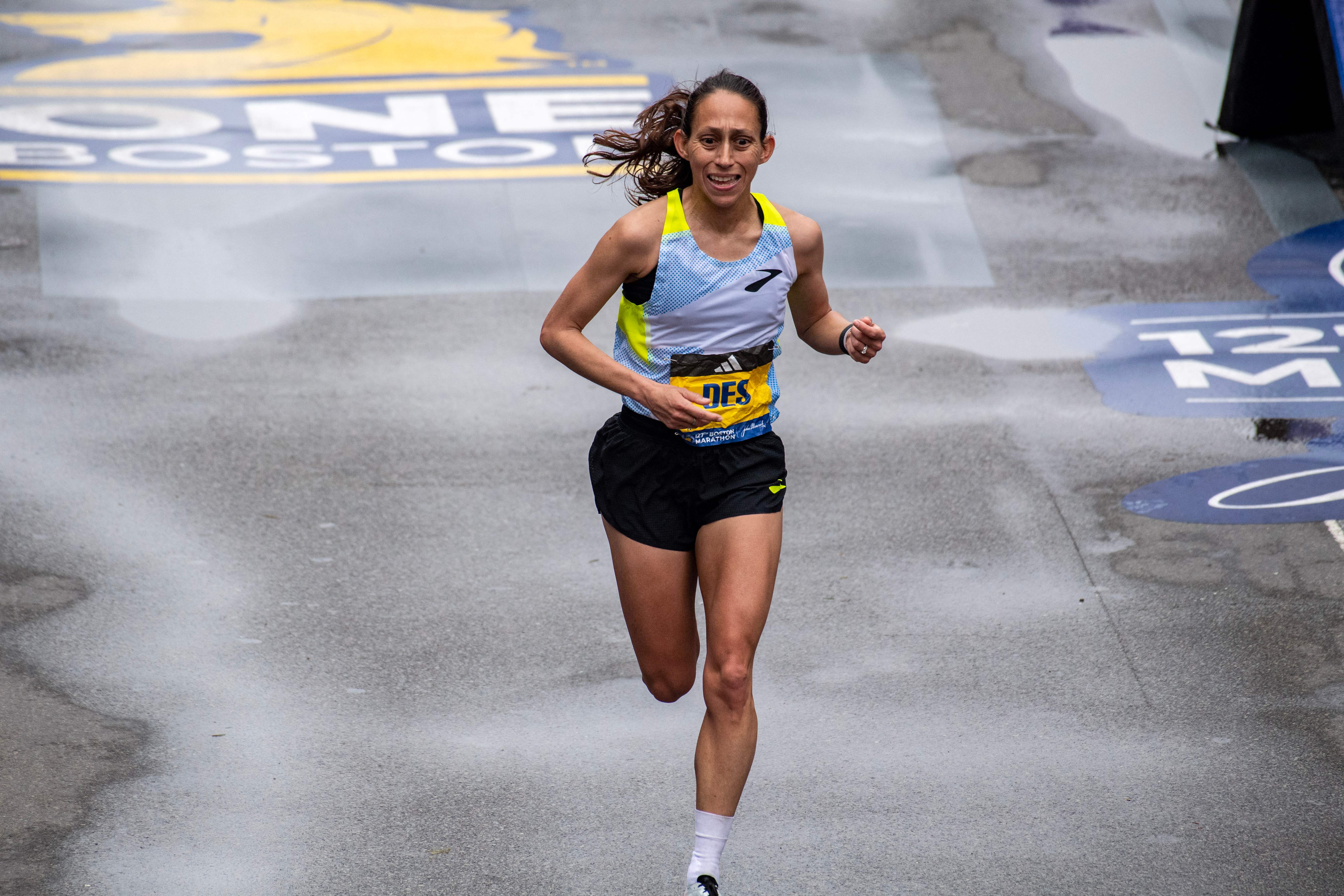 Des Linden makes her way to the finish line during the 127th Boston Marathon in Boston, Massachusetts on April 17, 2023. – Kenya’s Hellen Obiri stormed to a brilliant victory in the women’s race at the Boston Marathon on Monday, winning a thrilling closing duel with Amane Beriso to take the title in only her second race over the distance. (Photo by Joseph Prezioso / AFP) (Photo by JOSEPH PREZIOSO/AFP via Getty Images)