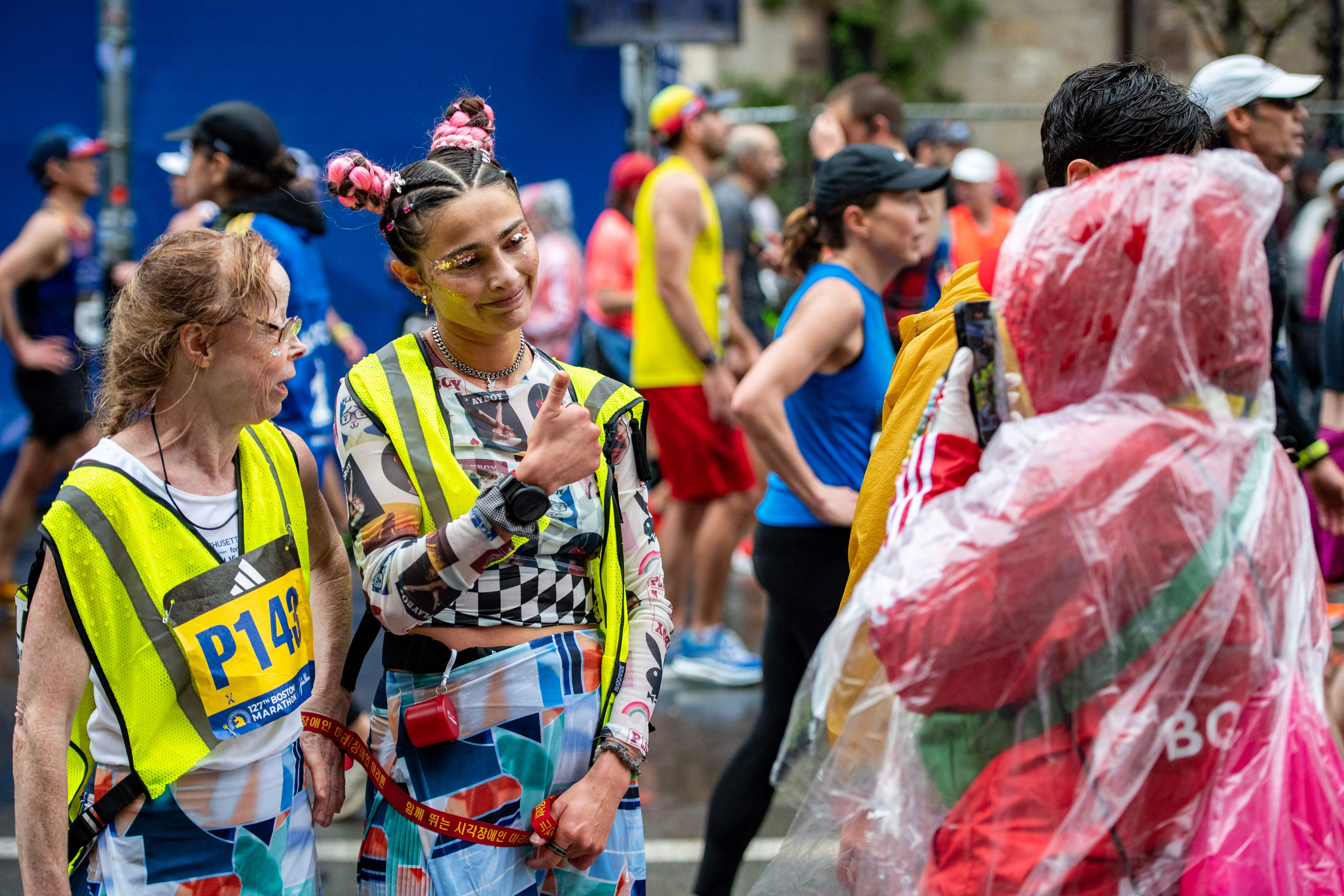 Runner takes a photo after finishing the race during the 127th Boston Marathon in Boston, Massachusetts on April 17, 2023. – In wet and windy conditions, 2022 champion Chebet of Kenya took his time before surging away in the closing stages to become the first man to defend the Boston crown since compatriot Robert Kipkoech Cheruiyot completed a hat trick of victories between 2006-2008. (Photo by Joseph Prezioso / AFP) (Photo by JOSEPH PREZIOSO/AFP via Getty Images)