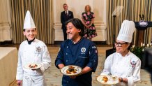 WASHINGTON, DC  April 24, 2023:

Guest Chef Edward Lee (center), White House Executive ChefCrisComerford (right), and White House Executive Pastry Chef Susie Morrison display the dishes to be served during a media preview of Wednesday's State Dinner in the State Dining room of the White House on Monday, April 24, 2023.

(Photo by Demetrius Freeman/The Washington Post via Getty Images)