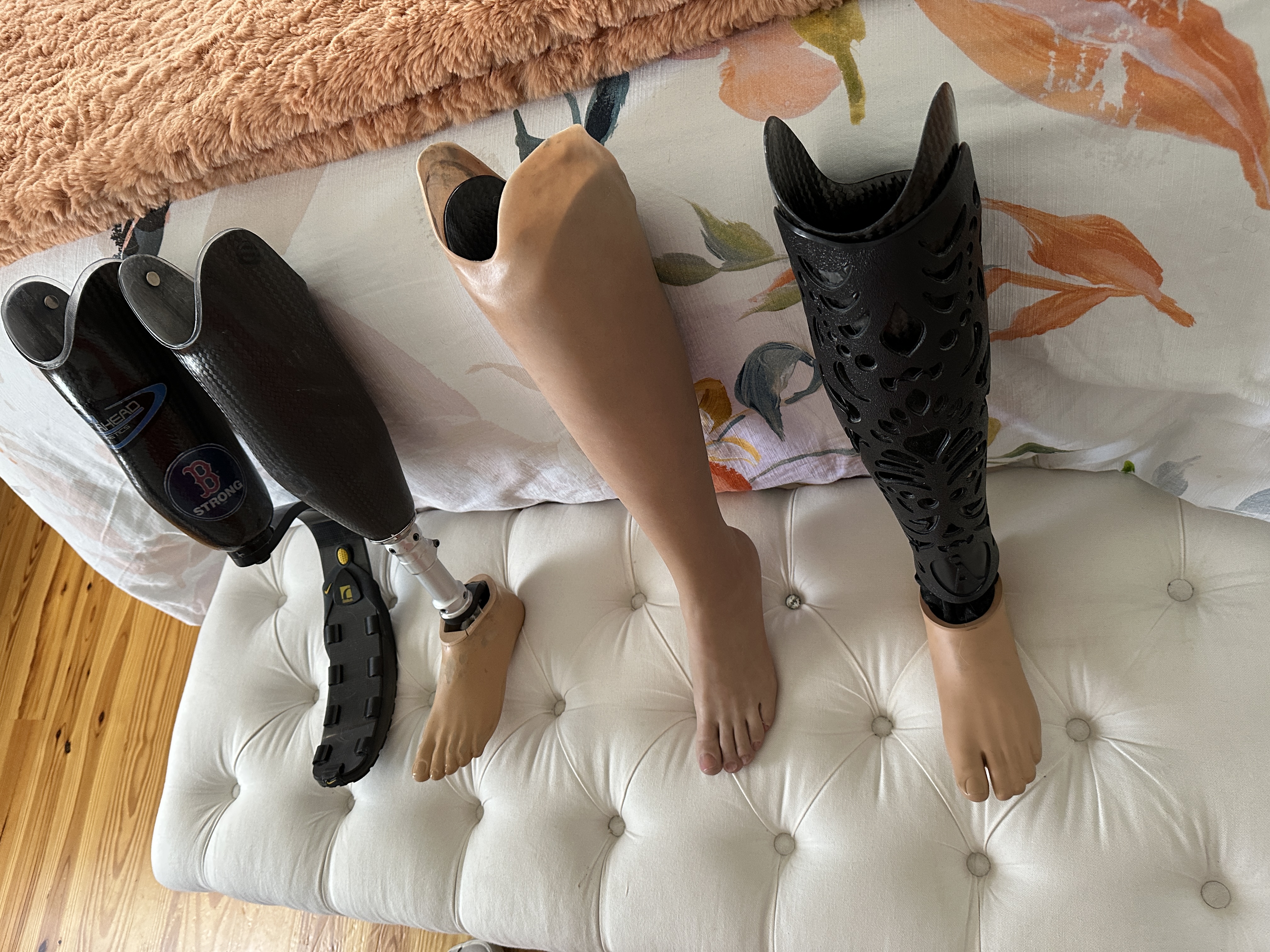 prosthetic legs against a bed