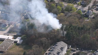 A brush fire sent smoke above Norwood, Massachusetts, on Thursday, April 20, 2023.