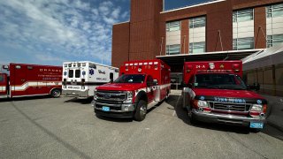 Ambulances that helped take students to a hospital from Dexter Park School in Orange, Massachusetts, on Tuesday, April 4, 2023, after they came into contact with a spicy gum.