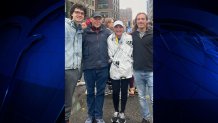 Patty Hung with family after completing her record-breaking 37th Boston Marathon on Monday, April 17, 2023.